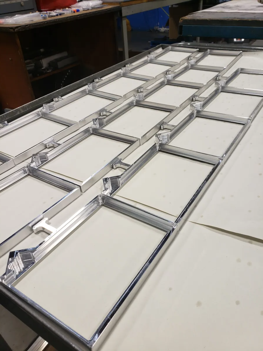 assorted paintings on white painted wall